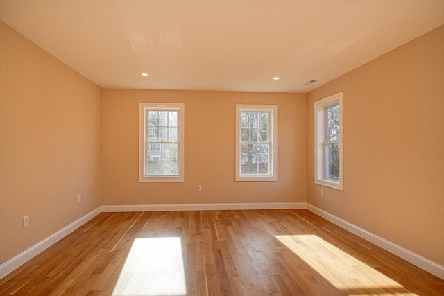 empty room with light hardwood / wood-style floors