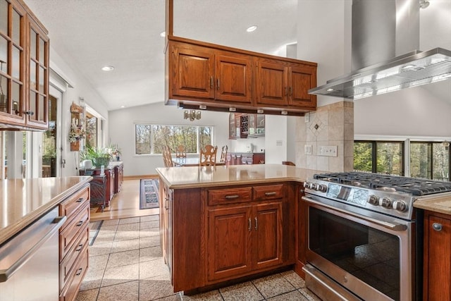 16 Wadsworth Ln, Dartmouth, MA 02748 - kitchen featuring appliances with stainless steel finishes, wall chimney range hood, light countertops, recessed lighting, and vaulted ceiling