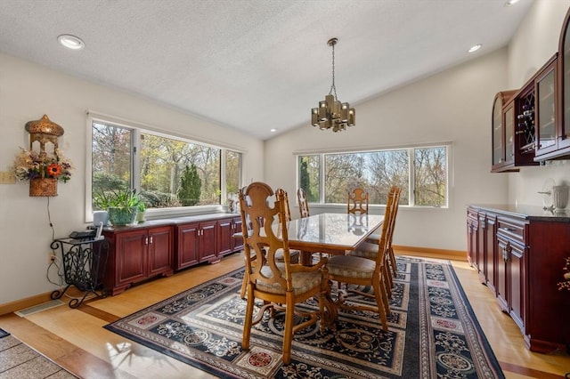 16 Wadsworth Ln, Dartmouth, MA 02748 - dining area with a chandelier, lofted ceiling, baseboards, recessed lighting, and a textured ceiling
