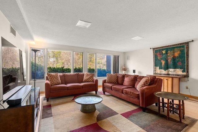 16 Wadsworth Ln, Dartmouth, MA 02748 - living room featuring a textured ceiling and baseboards