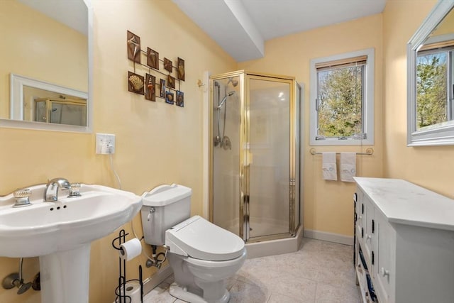 16 Wadsworth Ln, Dartmouth, MA 02748 - full bathroom featuring a shower stall, toilet, baseboards, and tile patterned flooring