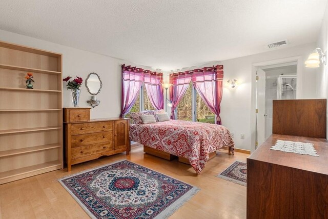 16 Wadsworth Ln, Dartmouth, MA 02748 - bedroom with wood finished floors and a textured ceiling