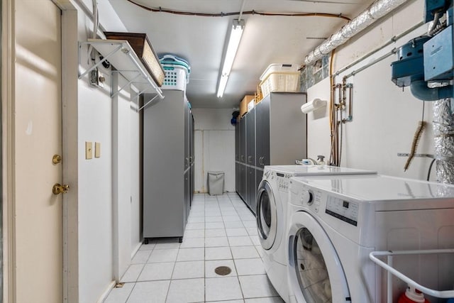 16 Wadsworth Ln, Dartmouth, MA 02748 - laundry room featuring washer and clothes dryer and light tile patterned floors