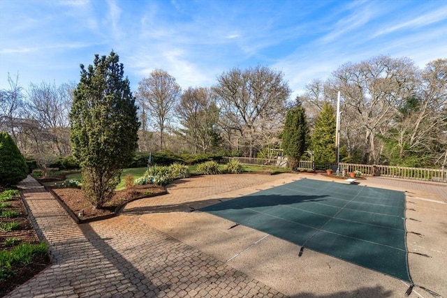 16 Wadsworth Ln, Dartmouth, MA 02748 - surrounding community with a swimming pool, a patio, and fence