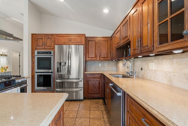 16 Wadsworth Ln, Dartmouth, MA 02748 - kitchen with stainless steel appliances, a sink, lofted ceiling, light countertops, and tasteful backsplash