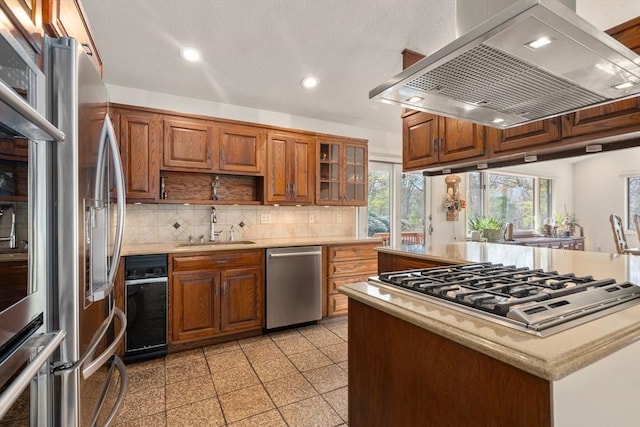 16 Wadsworth Ln, Dartmouth, MA 02748 - kitchen featuring stainless steel appliances, wall chimney exhaust hood, a sink, recessed lighting, and tasteful backsplash