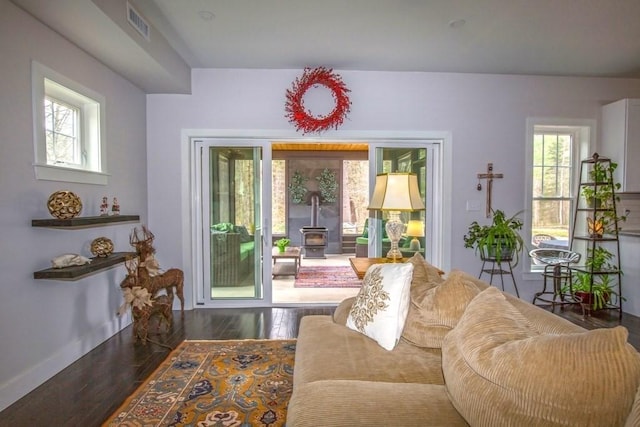 56 Otis-Tolland Rd, Blandford, MA 01008 - living room featuring a wood stove, healthy amount of natural light, and wood finished floors