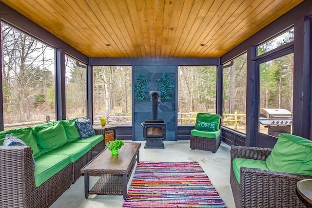 56 Otis-Tolland Rd, Blandford, MA 01008 - sunroom with an outdoor living space, plenty of natural light, and a wood stove