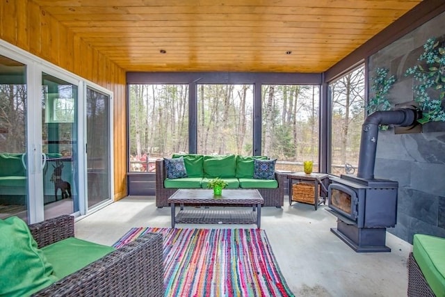 56 Otis-Tolland Rd, Blandford, MA 01008 - sunroom / solarium featuring an outdoor living space and a wood stove