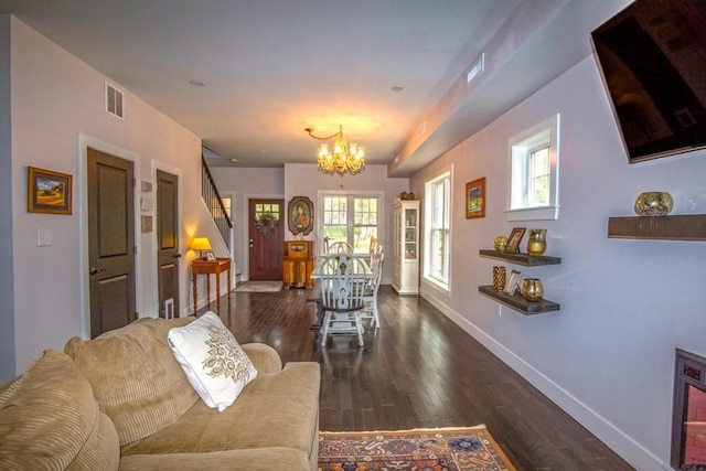 56 Otis-Tolland Rd, Blandford, MA 01008 - living area featuring a chandelier, wood finished floors, and stairway