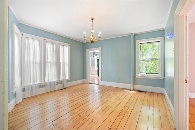 661 Main St, Hanson, MA 02341 - unfurnished room featuring a chandelier, crown molding, and light wood-type flooring