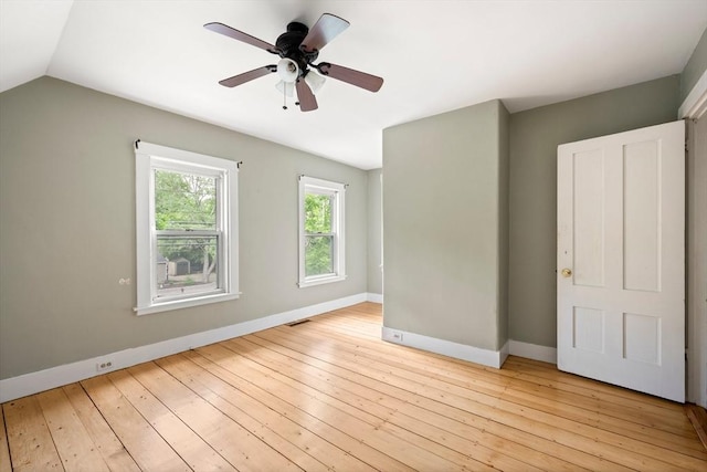 661 Main St, Hanson, MA 02341 - unfurnished bedroom with vaulted ceiling, light wood-type flooring, and ceiling fan