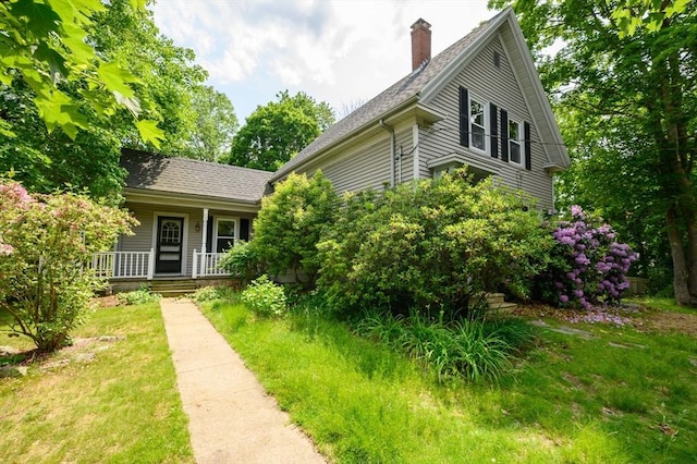 661 Main St, Hanson, MA 02341 - view of front of property featuring a chimney, covered porch, and a shingled roof