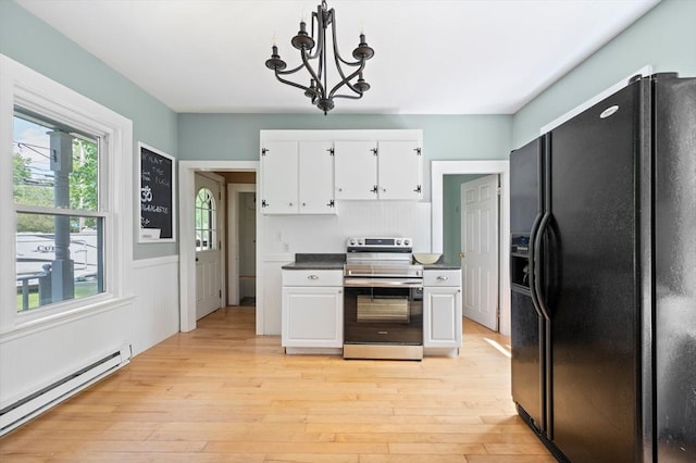 661 Main St, Hanson, MA 02341 - kitchen featuring black fridge with ice dispenser, electric range, a baseboard heating unit, white cabinets, and a wainscoted wall