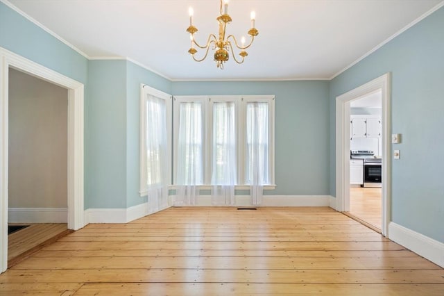 661 Main St, Hanson, MA 02341 - unfurnished dining area featuring a chandelier, light wood finished floors, and crown molding
