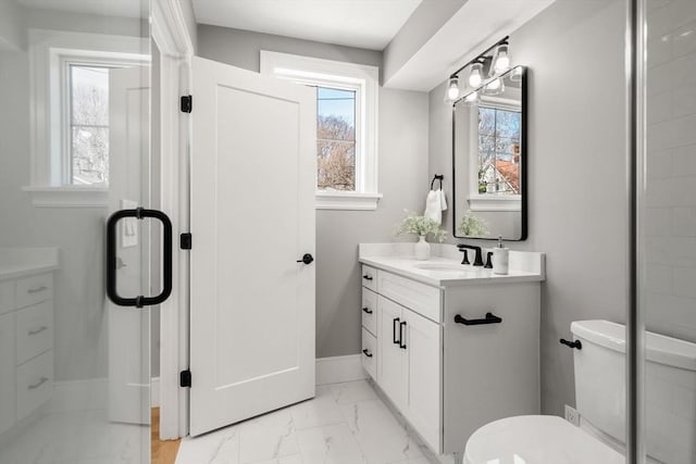 110 Fayette Unit 110, Watertown, MA 02472 - bathroom featuring toilet, marble finish floor, baseboards, and vanity