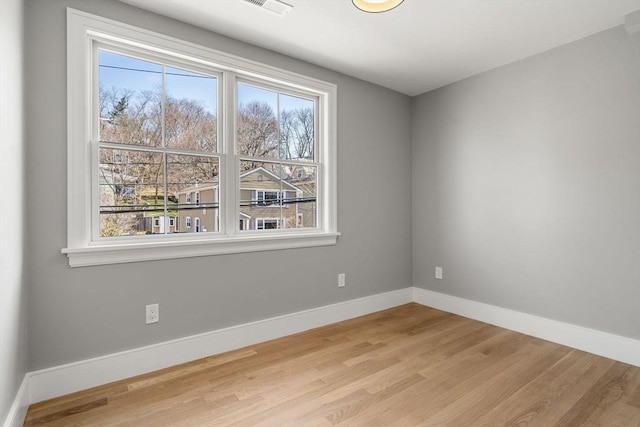 110 Fayette Unit 110, Watertown, MA 02472 - empty room with wood finished floors, baseboards, and visible vents