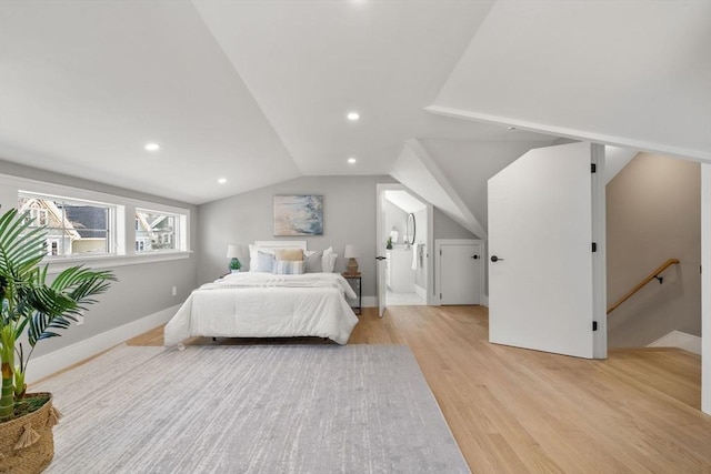 110 Fayette Unit 110, Watertown, MA 02472 - bedroom featuring baseboards, light wood-type flooring, recessed lighting, connected bathroom, and vaulted ceiling