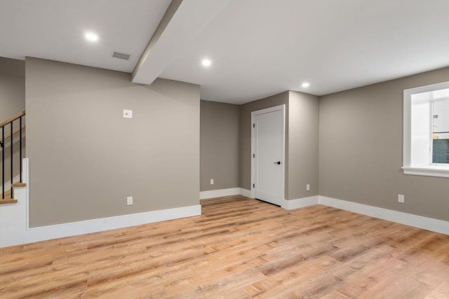 110 Fayette Unit 110, Watertown, MA 02472 - below grade area featuring baseboards, recessed lighting, stairway, light wood-style floors, and visible vents