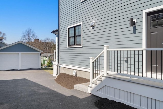 110 Fayette Unit 110, Watertown, MA 02472 - view of property exterior with a detached garage, an outdoor structure, and crawl space