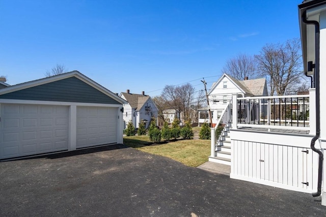 110 Fayette Unit 110, Watertown, MA 02472 - view of yard with an outdoor structure, a garage, and stairs