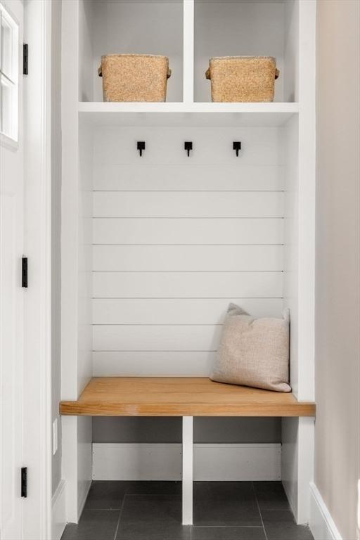 110 Fayette Unit 110, Watertown, MA 02472 - mudroom featuring dark tile patterned flooring and baseboards