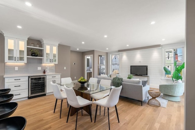 110 Fayette Unit 110, Watertown, MA 02472 - dining area featuring light wood-type flooring, recessed lighting, beverage cooler, and indoor bar