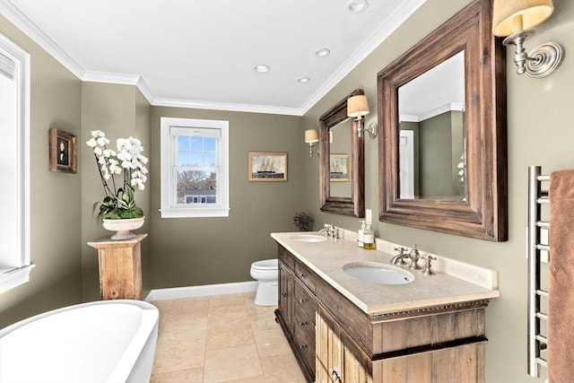 bathroom with a sink, crown molding, double vanity, baseboards, and a soaking tub