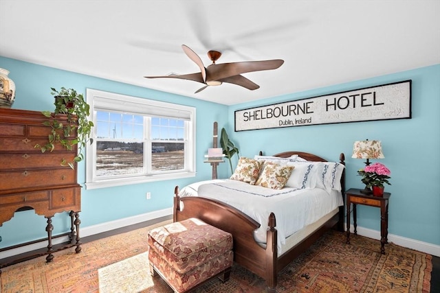 bedroom with baseboards and ceiling fan