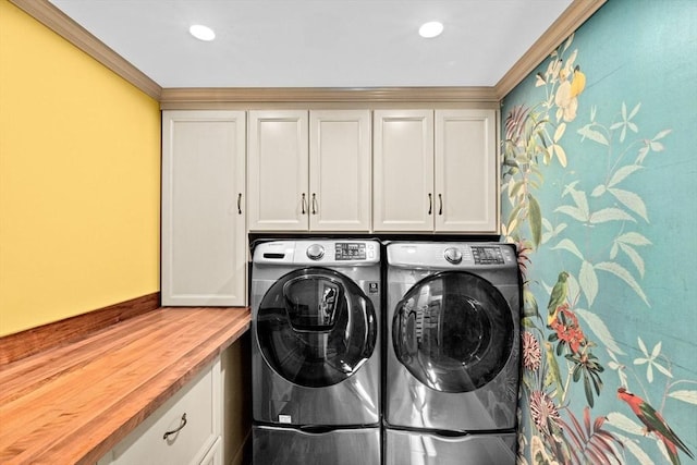 laundry room featuring recessed lighting, cabinet space, independent washer and dryer, and ornamental molding