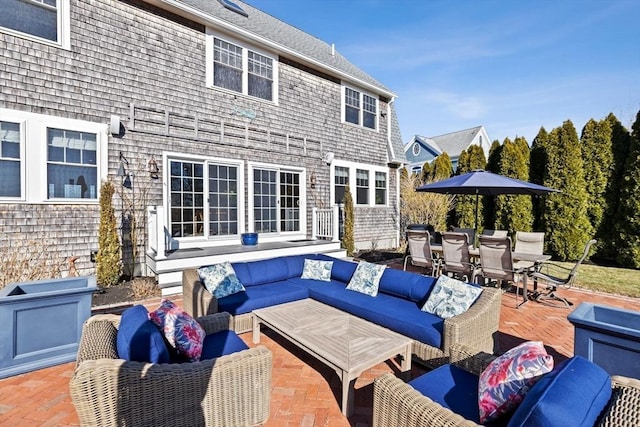 view of patio with outdoor dining space and outdoor lounge area