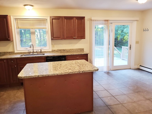 kitchen featuring a wealth of natural light and light stone counters