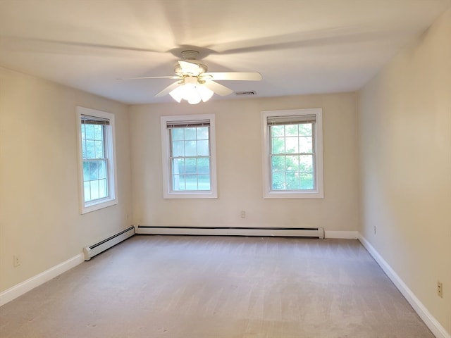 carpeted spare room with ceiling fan