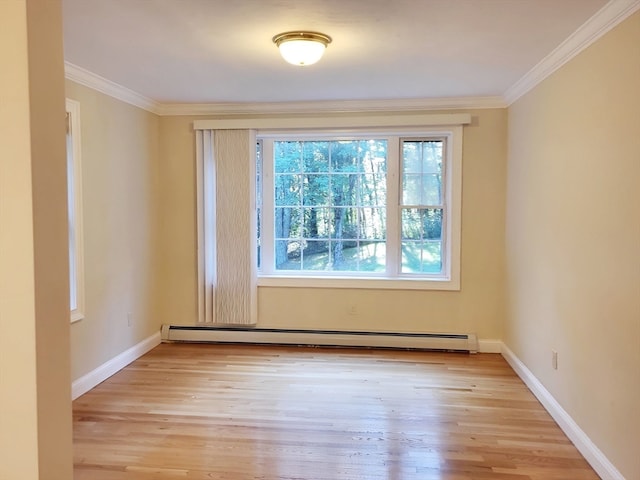 empty room with a baseboard radiator, ornamental molding, and light hardwood / wood-style flooring