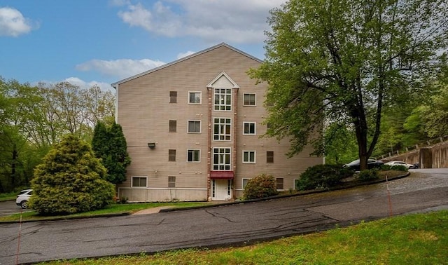 view of property with fence