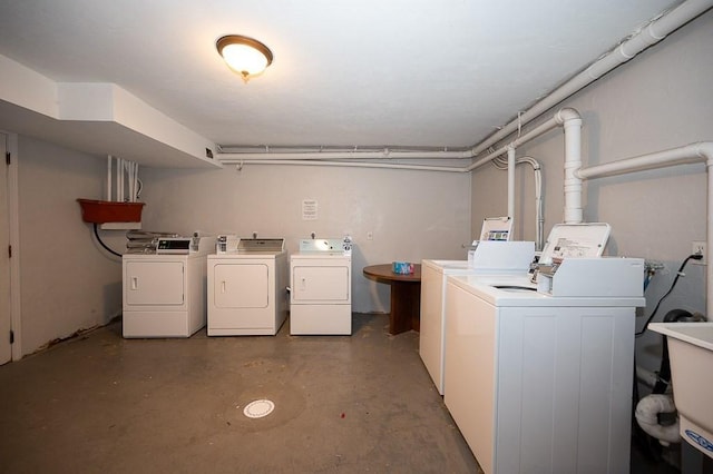 community laundry room with separate washer and dryer