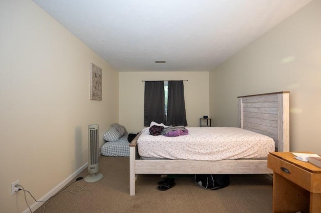 bedroom featuring carpet flooring and baseboards