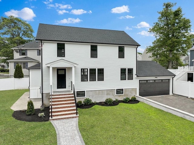 79 Hutchins Rd, Medford, MA 02155 - view of front of home featuring asphalt driveway, a garage, and a shingled roof