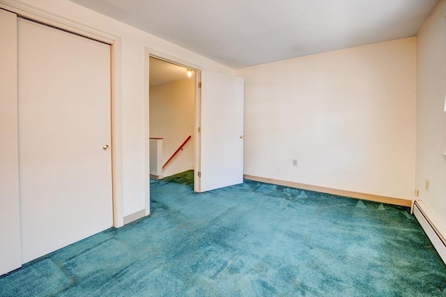 90 Roper St Unit G, Lowell, MA 01852 - unfurnished bedroom featuring a baseboard radiator and carpet