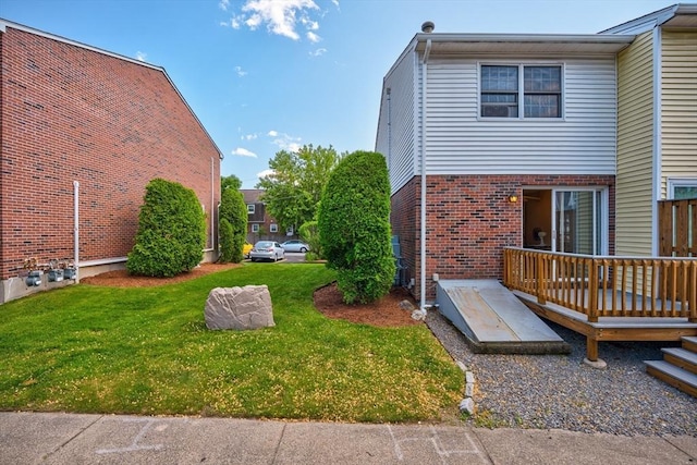 90 Roper St Unit G, Lowell, MA 01852 - view of green lawn featuring a deck