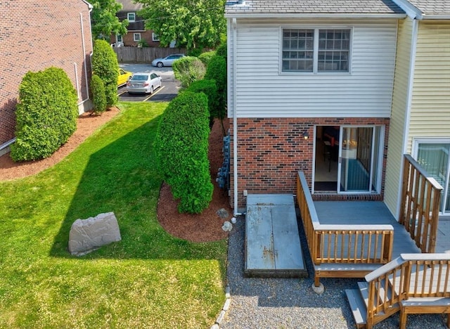 90 Roper St Unit G, Lowell, MA 01852 - rear view of house with a yard, brick siding, and a high end roof
