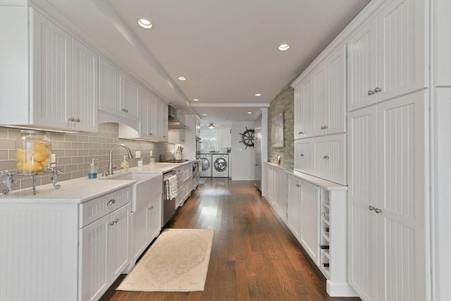 kitchen featuring dark hardwood / wood-style flooring, backsplash, and white cabinets