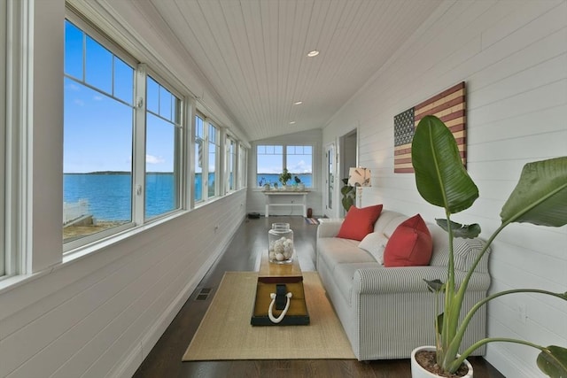 sunroom featuring lofted ceiling, wood ceiling, and a water view