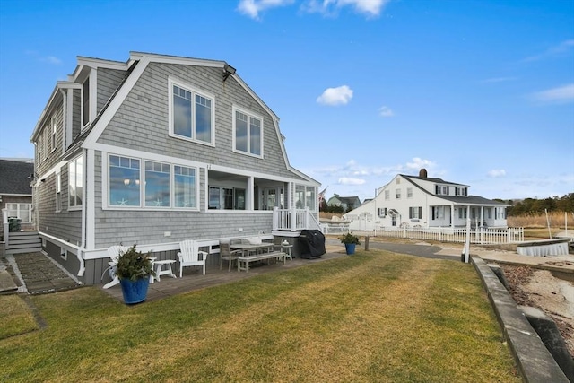 back of house featuring a yard