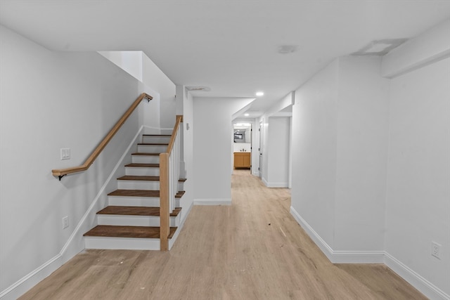 stairs with wood-type flooring