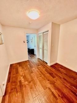 spare room with hardwood / wood-style flooring