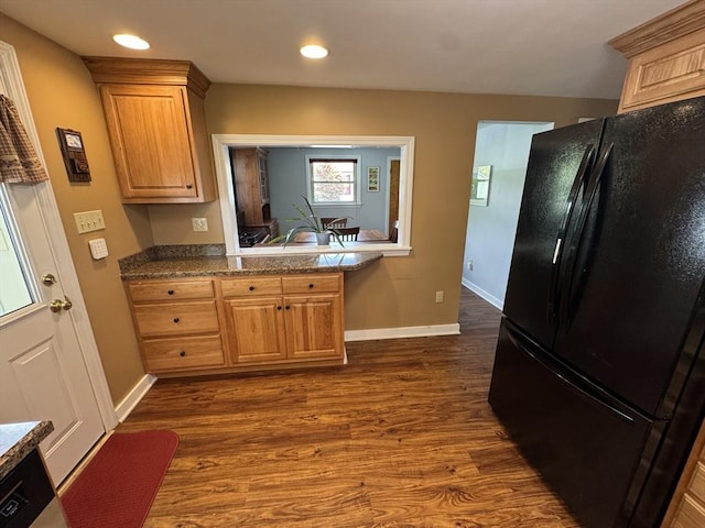 kitchen featuring freestanding refrigerator, dark wood-style floors, baseboards, and recessed lighting