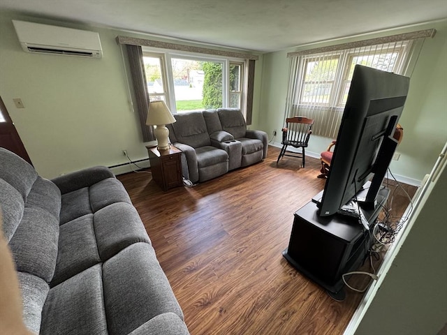 living room with a wall unit AC, wood finished floors, healthy amount of natural light, and a baseboard heating unit