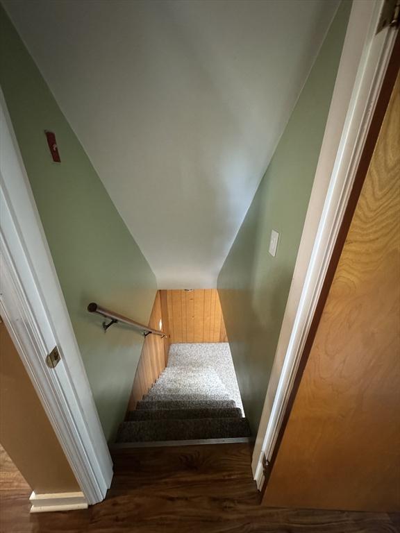 stairs with wood finished floors