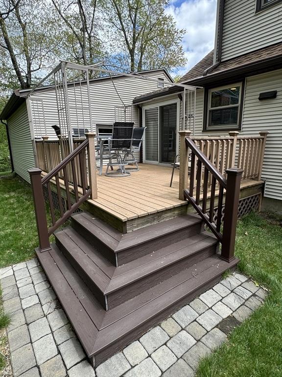 wooden terrace with outdoor dining area